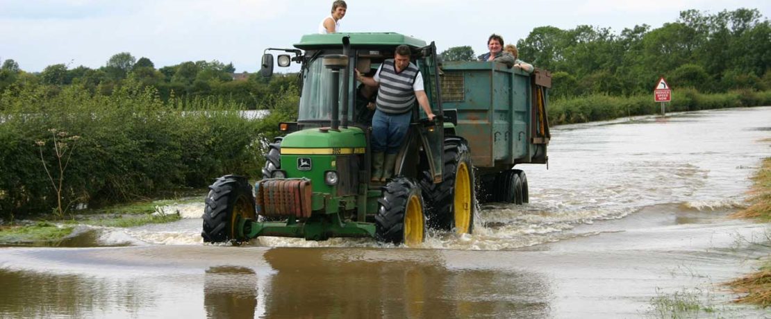 A tractor drives through flood waters in Bidford on Avon, Warwickshire Jon Whitton via Flickr (CC BY NC-ND 2.0)